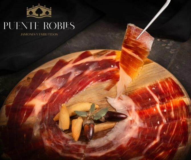 Dish with carefully sliced Iberian ham Puente Robles